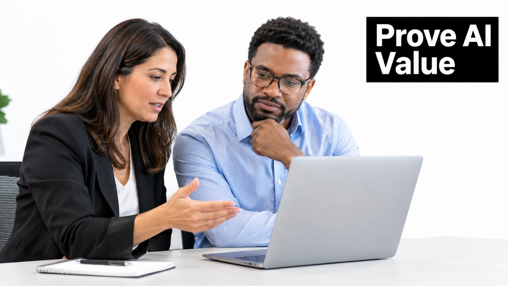 A businesswoman and a businessman collaborating on a project in a bright professional office environment.